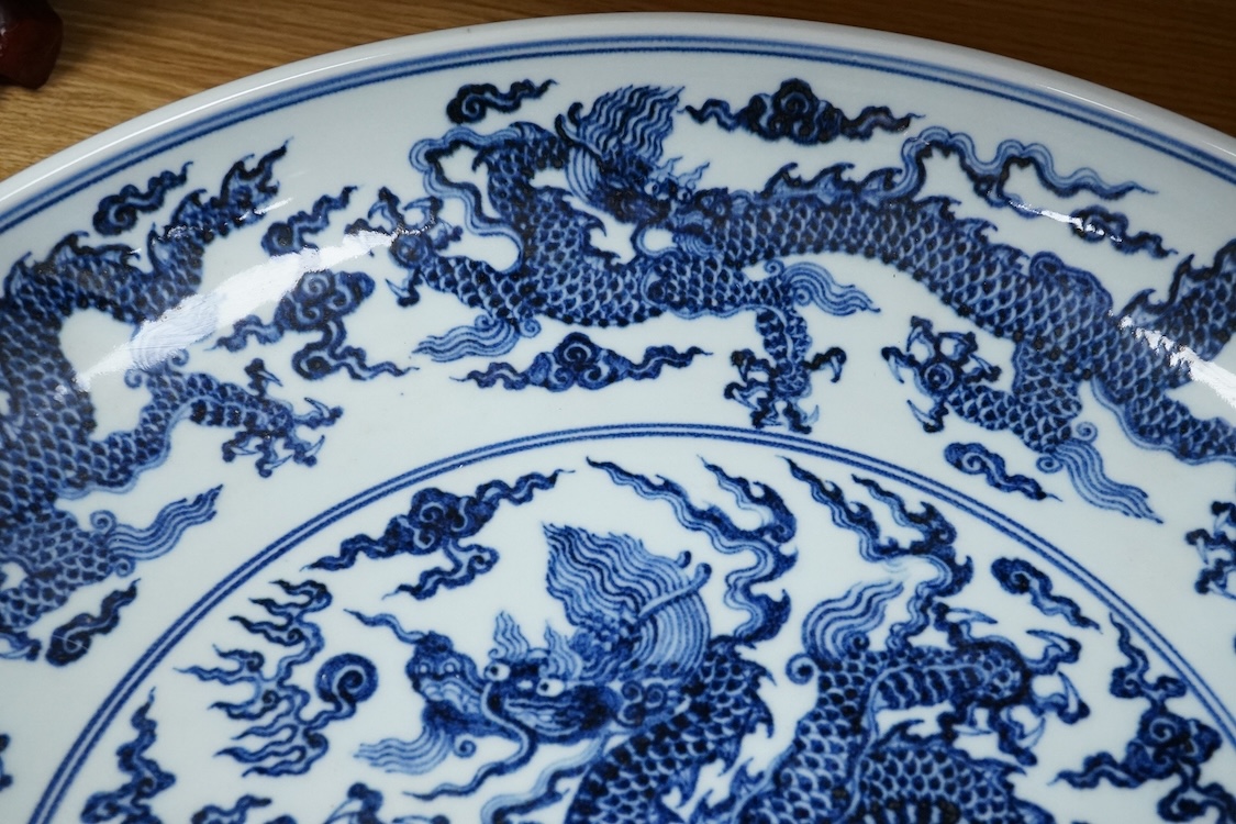 A large Chinese blue and white dragon charger, apocryphal Xuande mark, 45cm in diameter